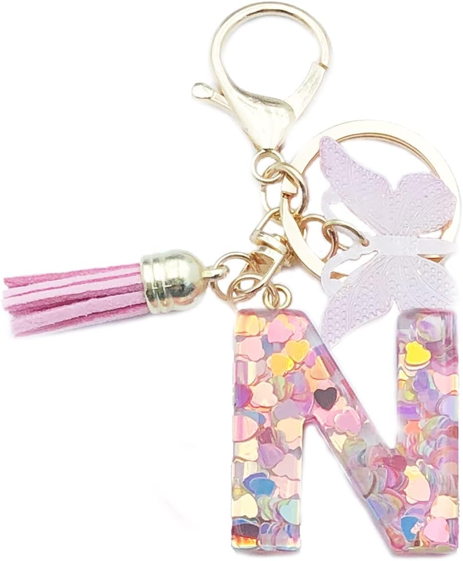Keychain with letter 'N' charm, tassel, and butterfly